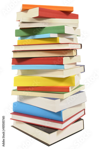 Very tall pile stack of various several lots books isolated on white background photo
