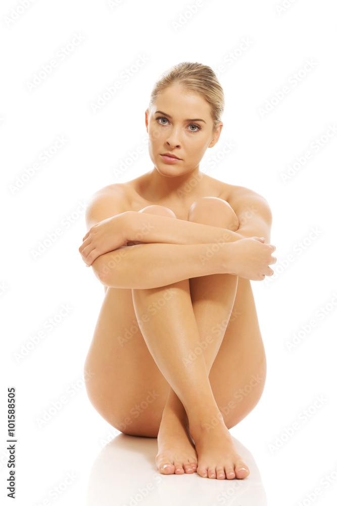 Fototapeta premium Nude woman sitting on the floor