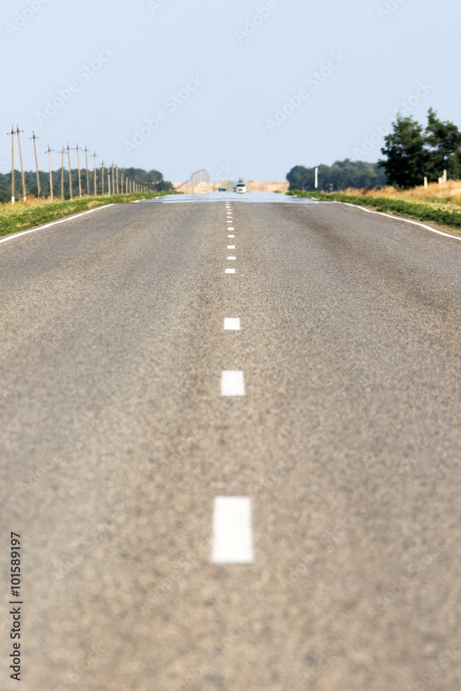 Fototapeta premium Road with a marking on the nature background