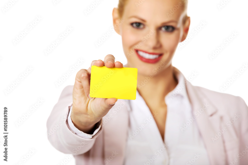 Young business woman holding small empty paper card Young business woman holding small empty paper card