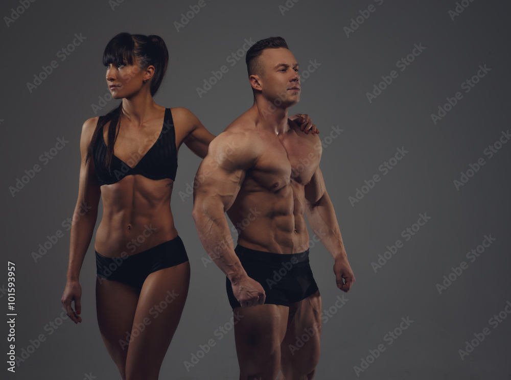 Bodybuilder and his girlfriend in underwear. Stock Photo
