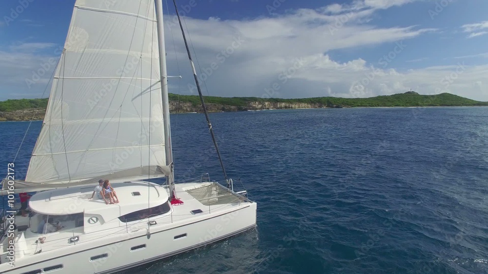 View of sailboat cruising on caribbean sea View of sailboat cruising on caribbean sea