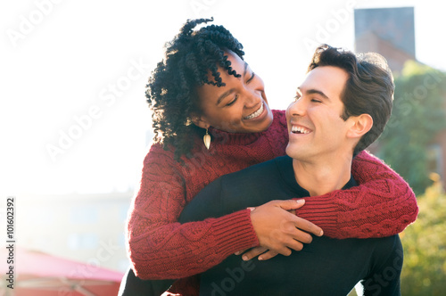 Couple piggyback outdoor