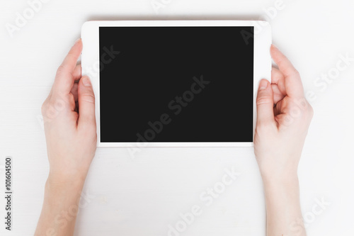 Young woman holding tablet