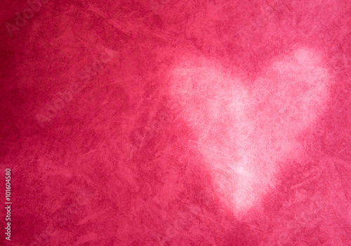 A heart shaped light shine on red background. Suit with valentine or lovely moment.