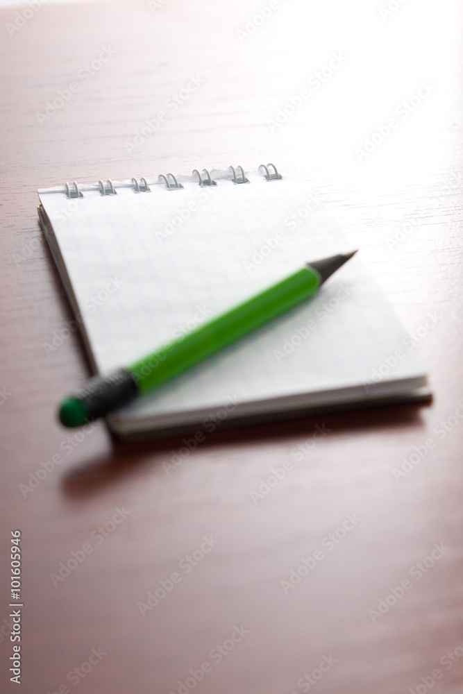 Pencil on the notepad composition Pencil on the notepad composition