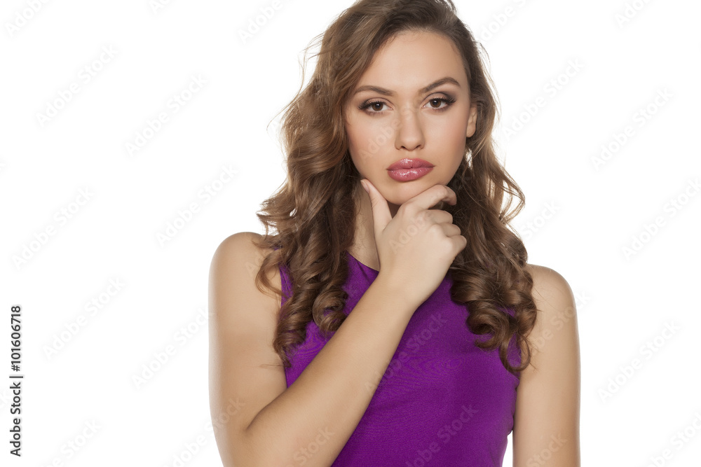 pensive young woman posing on a white background pensive young woman posing on a white background