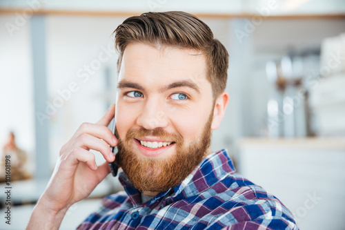 Man talking on the phone in coffee shop