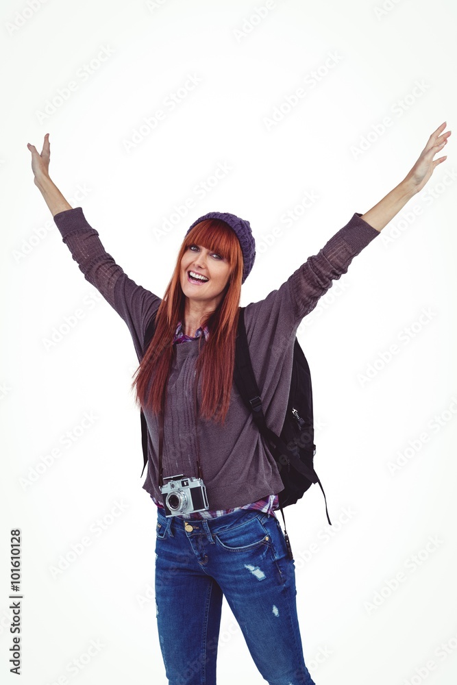 Obraz premium Smiling hipster woman with hands up