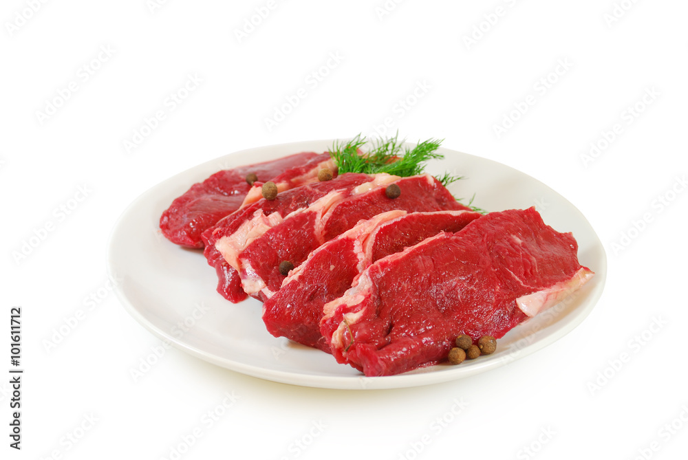 Raw Meat. Steaks of Beef or Veal With Dill in a Dish Isolated on White Background Raw Meat. Steaks of Beef or Veal With Dill in a Dish Isolated on White Background