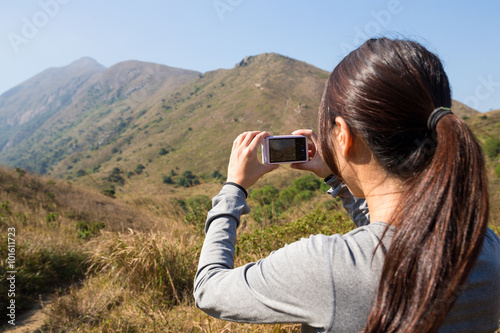 Woman take photo by digital camera