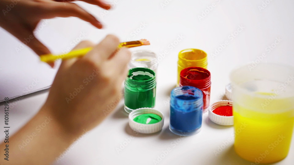 happy girl painting with gouache colour at home happy girl painting with gouache colour at home