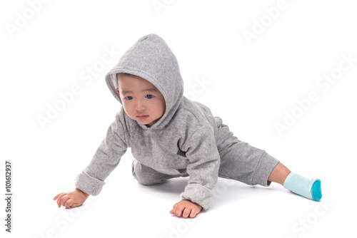 Asian baby in gray jacket with a hood, isolated on white backgro
