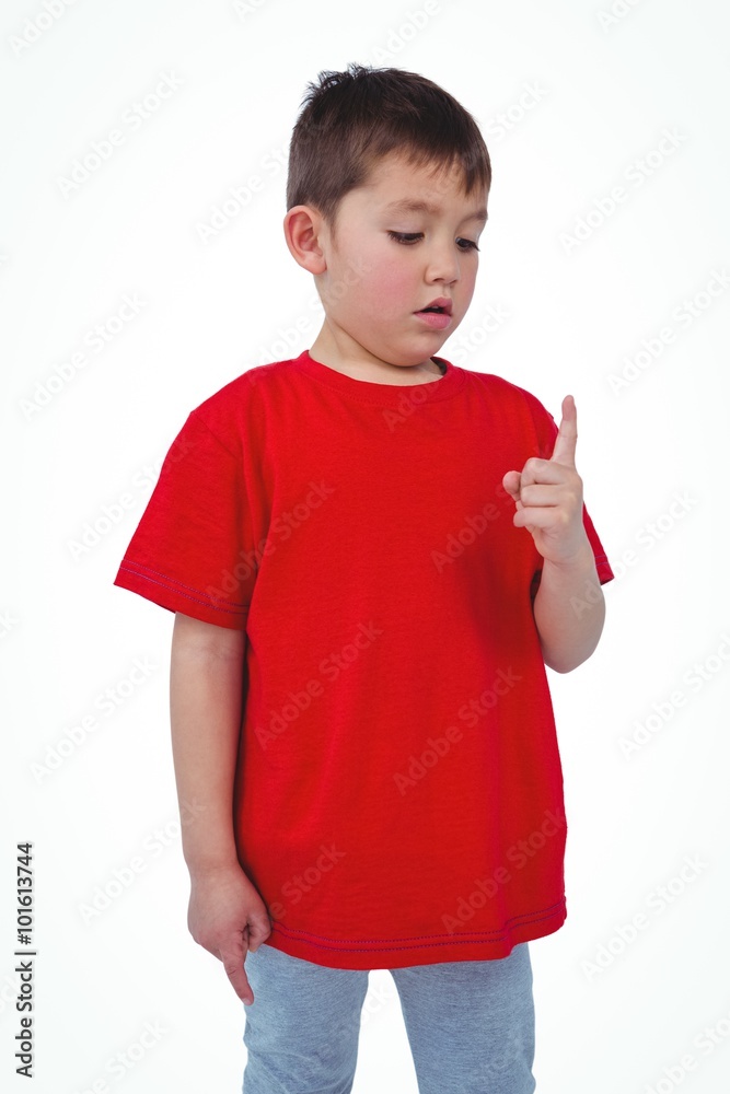 Unsmiling boy looking at his finger Unsmiling boy looking at his finger