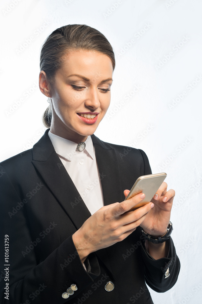 Business - Woman dials a phone number on your phone. Business - Woman dials a phone number on your phone.