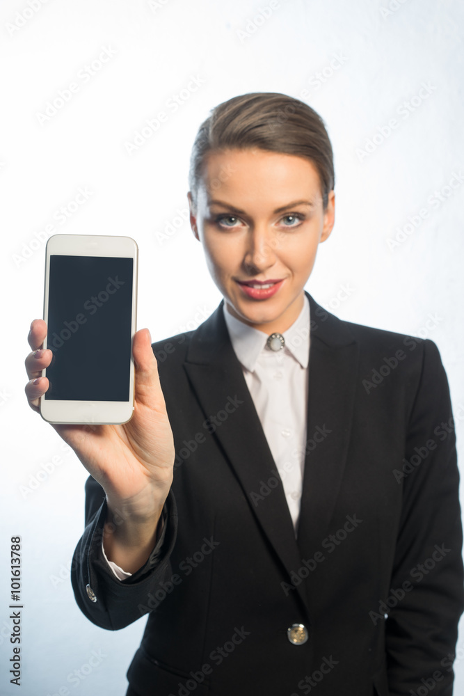 Girl shows information on your phone, hand extended forward. Girl shows information on your phone, hand extended forward.