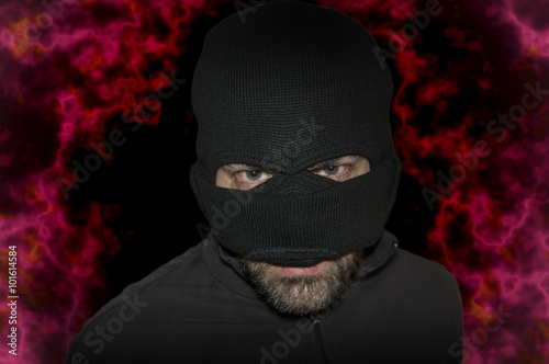 Man in a mask and a black shirt. Balaclava.