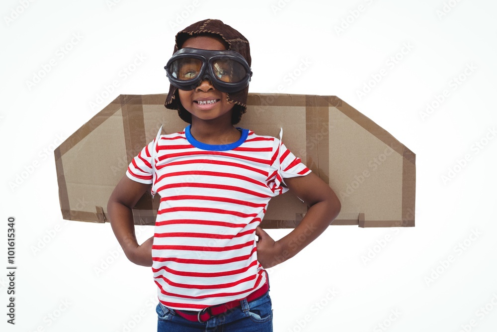 Fotografie Smiling boy pretending to be pilot