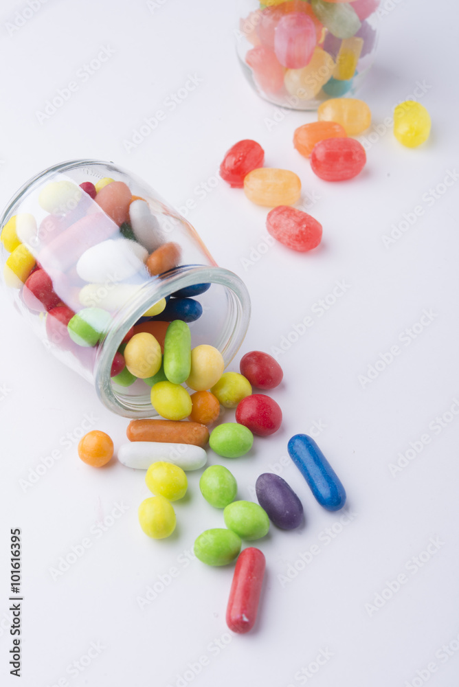 Multicolor candies in glass jars Multicolor candies in glass jars