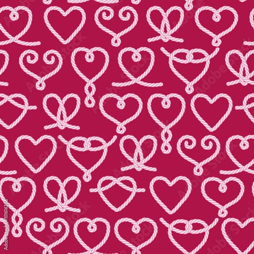 Seamless pattern made of rope hearts decorative knots