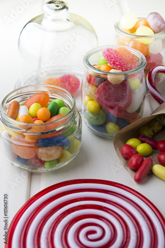 Multicolor candies in glass jars
