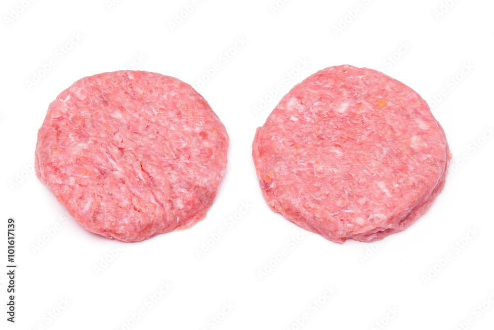 Raw crocodile meat burgers isolated on a white studio background
