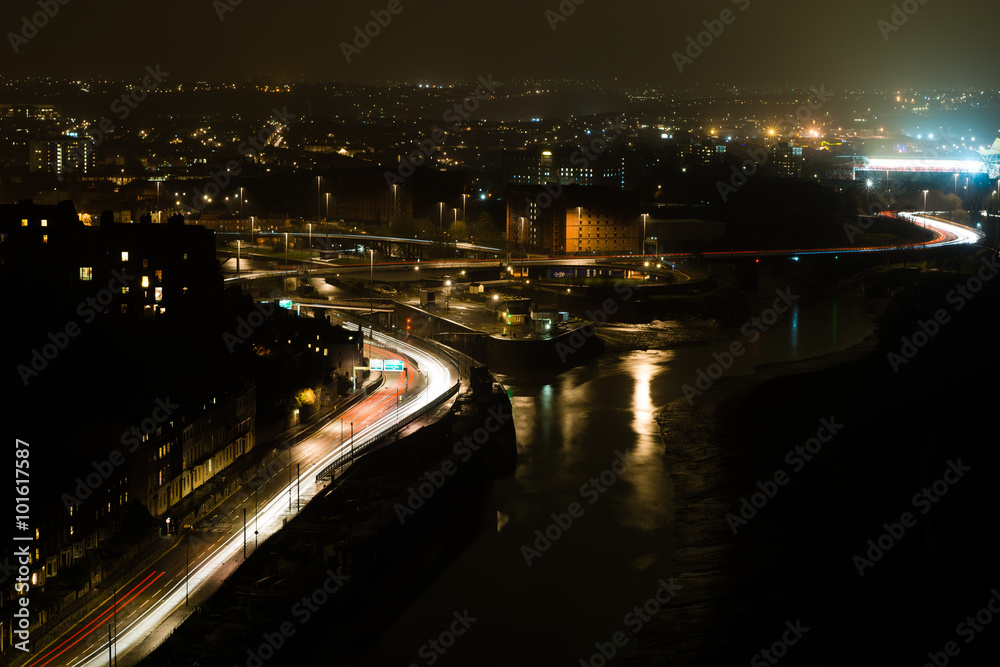 View of Bristol from the Clifton Suspension Bridge. A night cityscape focused on the split of the River Avon, encircling the Cumberland Basin
