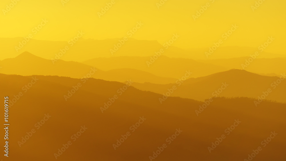 Obraz premium panorama of mountain silhouettes at sunset