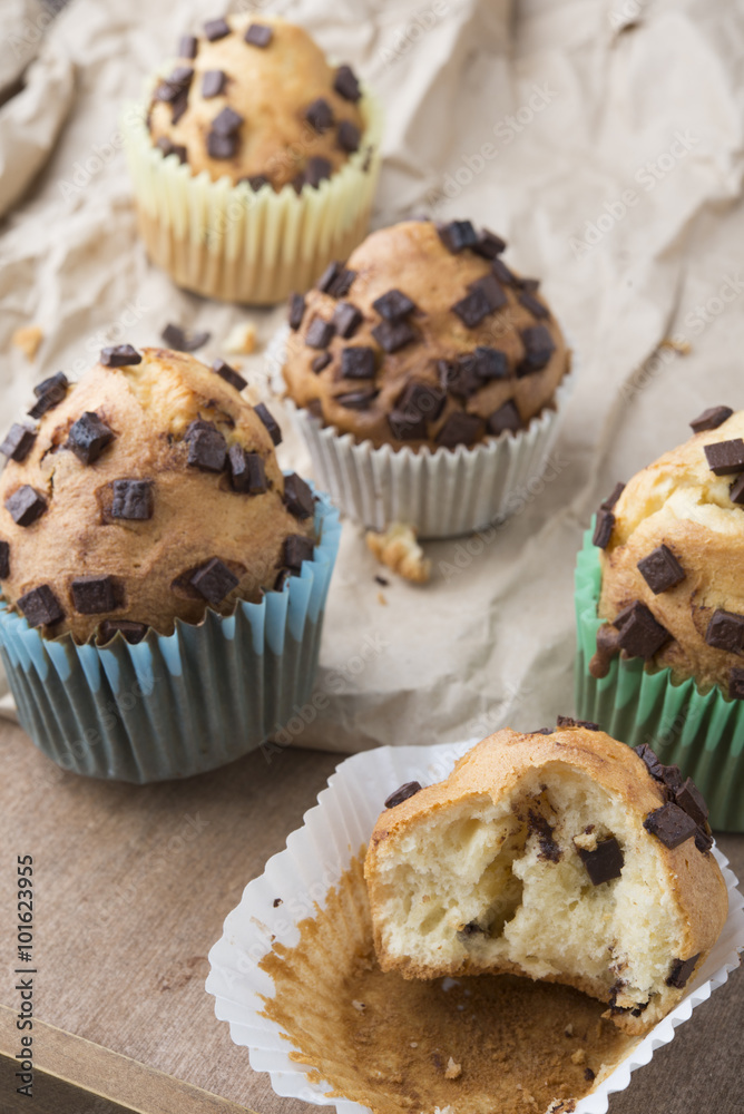 Muffins with chocolate on a wooden table Muffins with chocolate on a wooden table