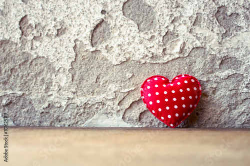 Red Heart on Wooden Floor With Retro Wall Background Concept of Love Valentines Day Background