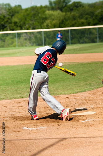 Teen baseball player swinging bat © tammykayphoto