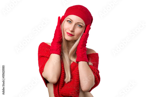 Beautiful girl posing in knitted red sweater and hat