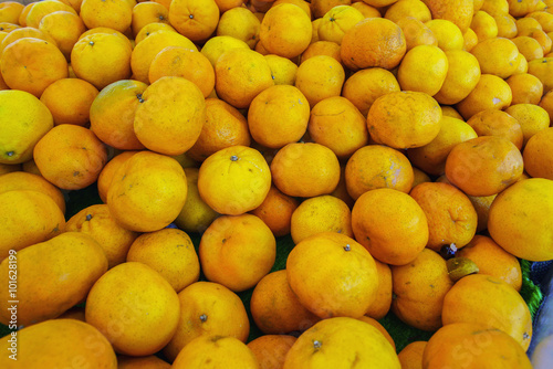 Closeup of oranges on a market.