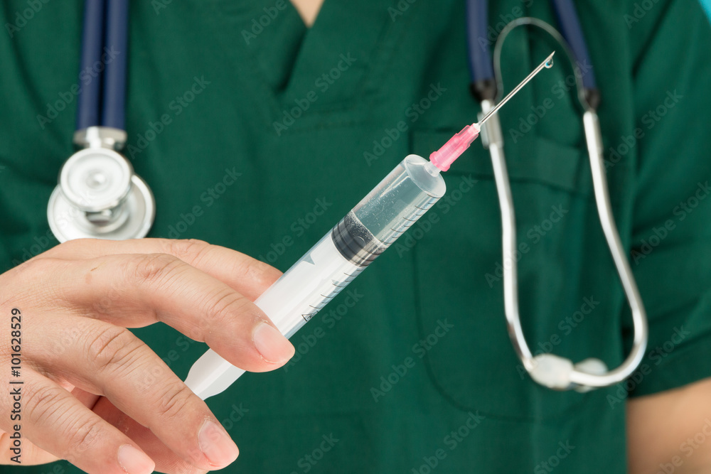 Doctor holding syringe ready for injection