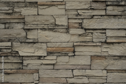 Modern slab stone wall as background. 