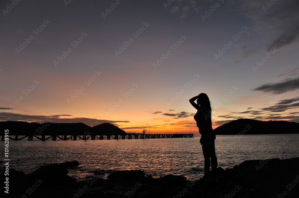 woman on beach in twilight