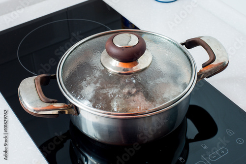 Pots and Pans cooking on stove