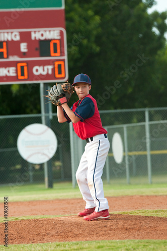 Teen baseball boy ready pitch from the mound.