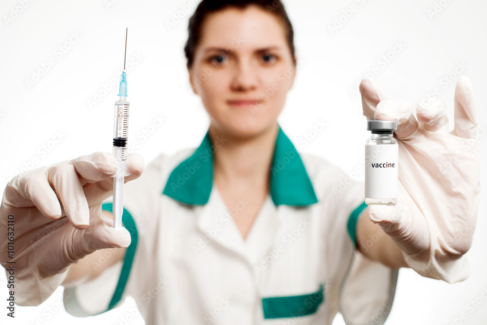 Medic holding syringe and capsule with vaccine in hand. Vaccination. Influenza Medic holding syringe and capsule with vaccine in hand. Vaccination. Influenza