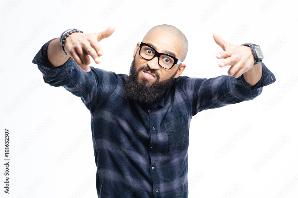 Naklejka premium Angry aggressive african man pointing to camera with both hands