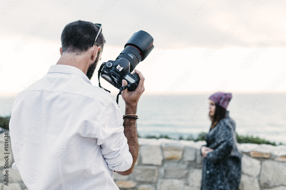 Photographer doing a photo shoot at a model Photographer doing a photo shoot at a model