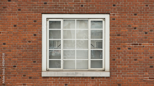 Window on brick red wall
