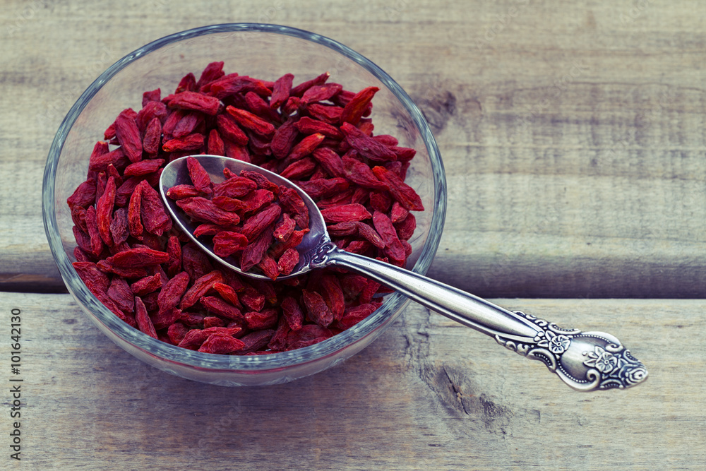Goji berries on a wood background - Filtered Image

