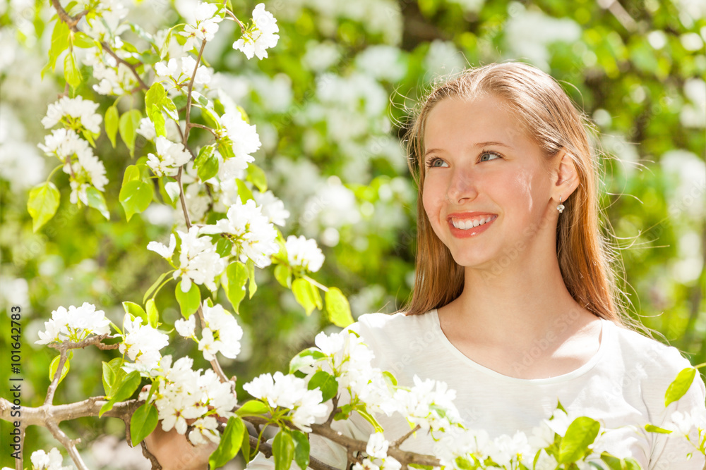 Looking beautiful teenager girl with white flowers Looking beautiful teenager girl with white flowers