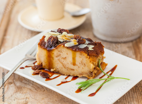 A dessert of bread pudding with caramel sauce photo