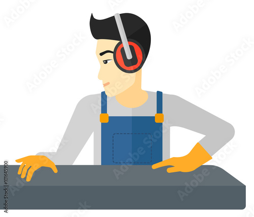 Man working on steel-rolling mill.