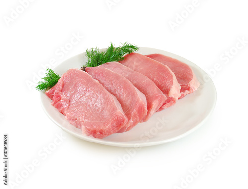 Raw Meat. Pork Steaks With Dill on a Dish Isolated against White Background