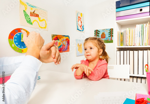 Little preschooler showing bird with her hand