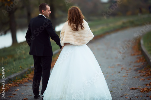 Wedding shot of bride and groom in park