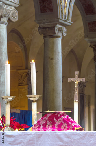 Altar with covered chalice during a traditional old latin rite Mass